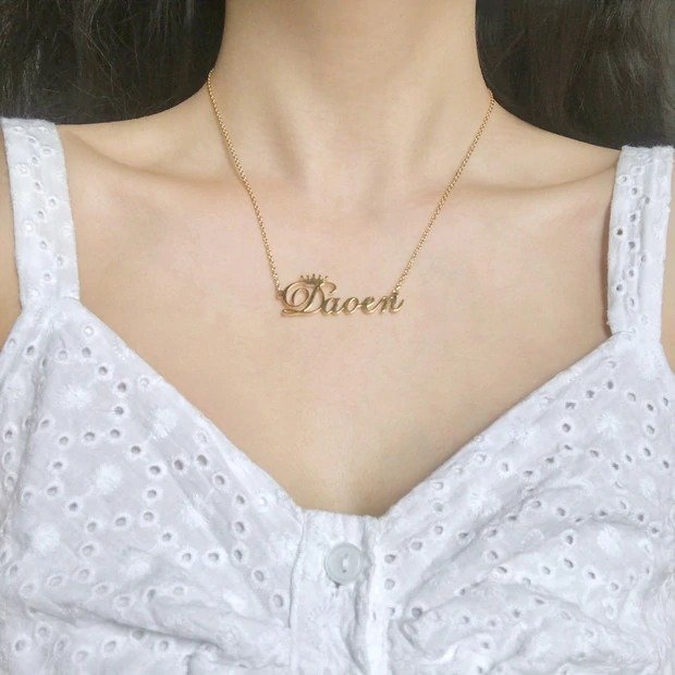 model photo of personalized crown name necklace