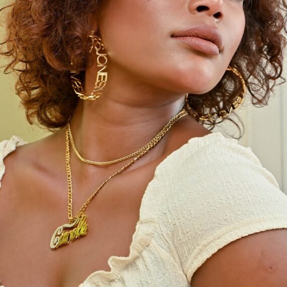 Double Pendant Name Necklace is a Double Plated Nameplate Necklace Design containing the First Letter in White Texture Cursive Script Handwriting Font 6